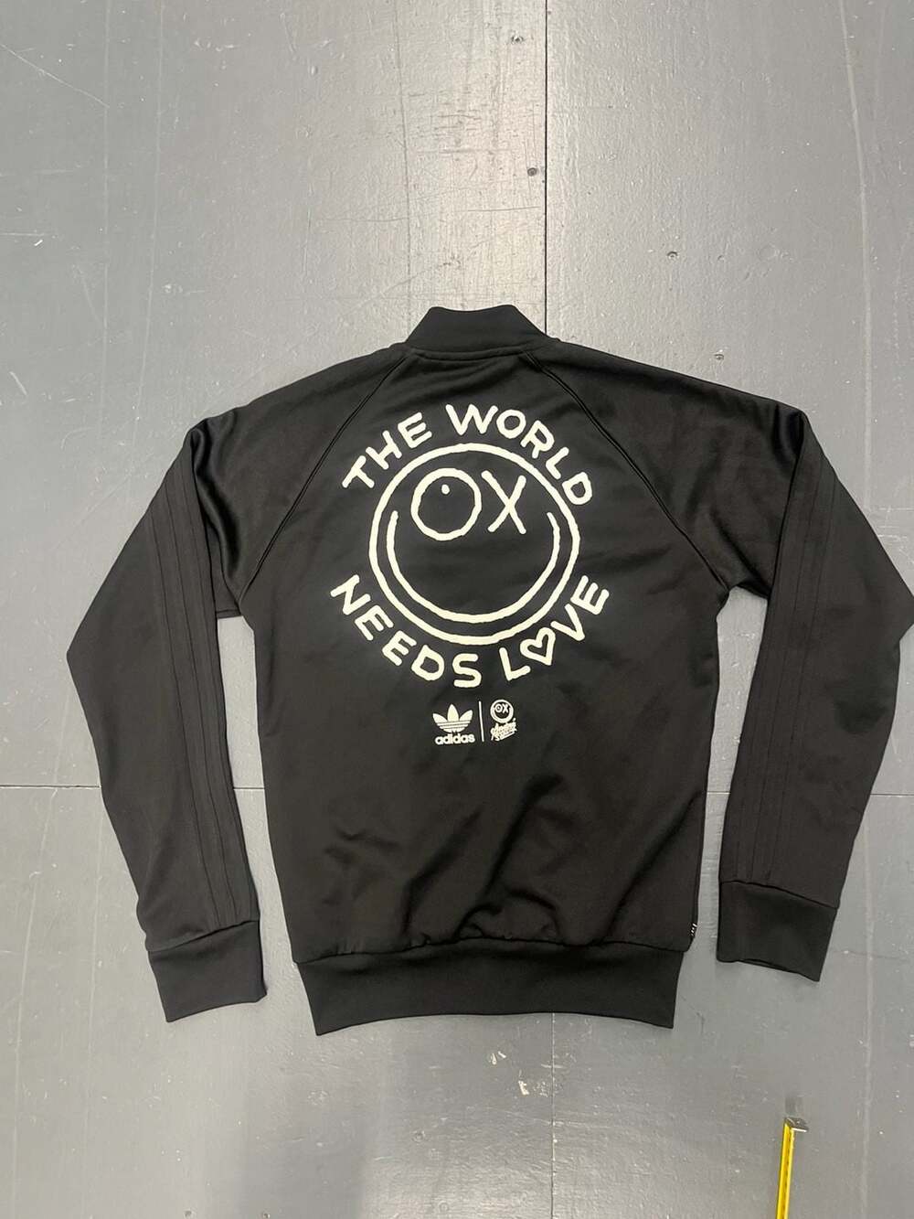 Adidas Originals x André Saraiva SST Track Jacket - The World Needs Love Black Z